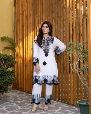 MIRAL Black & white tie-dye vibes with a touch of sparkle ✨with Black embroidery, sequins, tassels all my winter essential Monochrome, but make it majestic.”