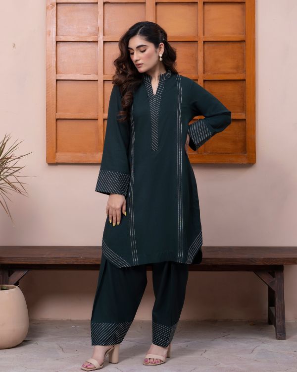 Luxury redefined: Bottle green winter outfit with subtle thread details perfect for your seasonal wardrobe,Soft thread work, strong style.